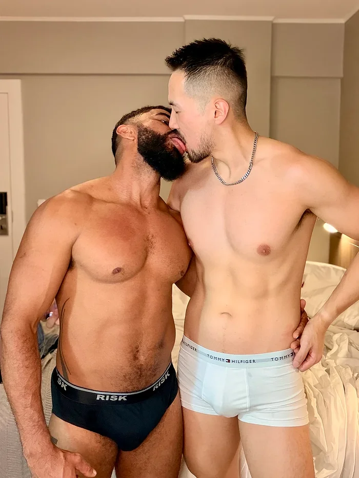 Adam Chen holding Friedrich Koupernik close in a hotel room in Brazil